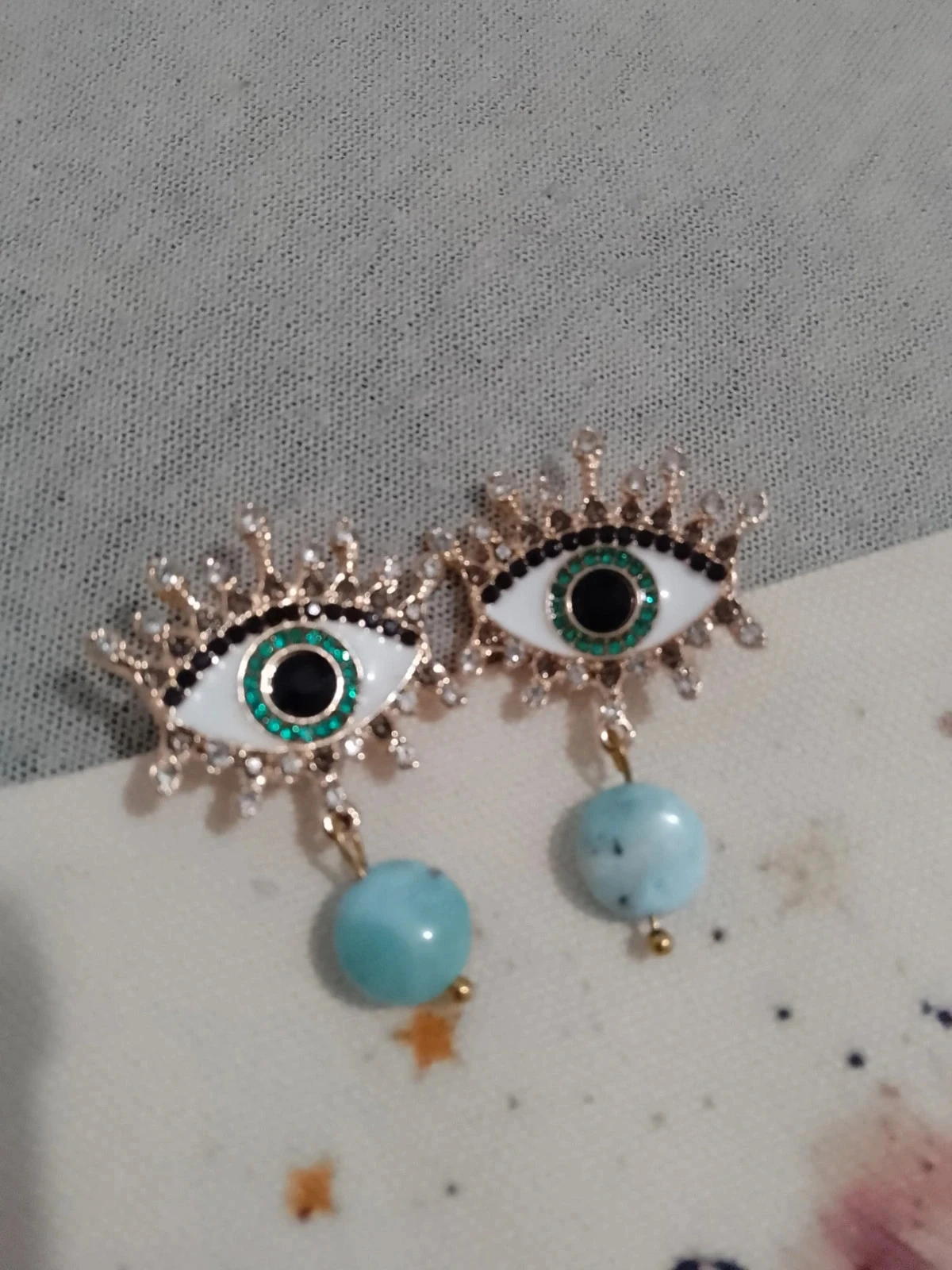 Boucles d'oreilles oeil gypsy dorés pierres de larimar du Brésil bleues turquoises